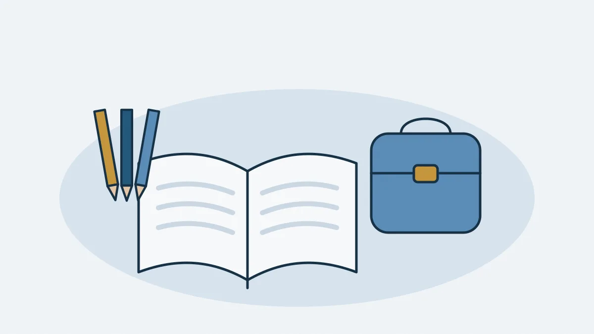 Un livre ouvert, un cartable et des crayons